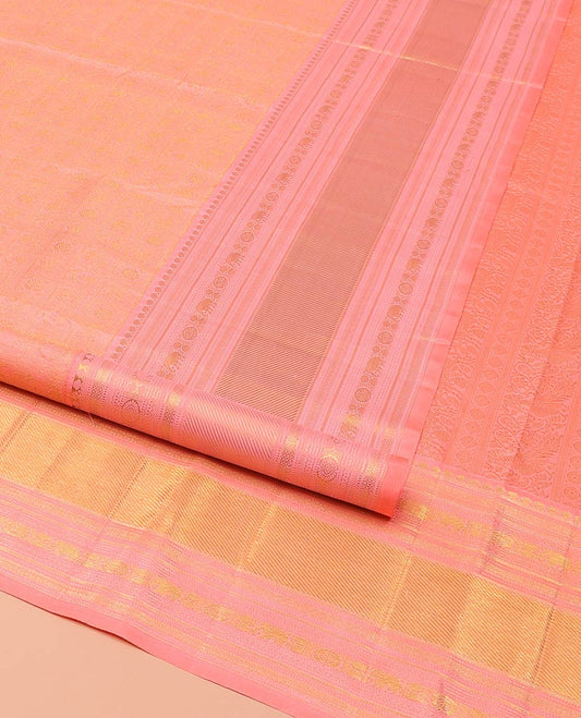 Pink Samudrika Silk Saree, Detailed with Jacquard Design on Its Body, Highlighted by Zari Border of Thilakam Mokku, Muthu, Mayil Kann, Yaanai, and Chakram Designs, Pallu of Mayil Kann Designs, and Paired with a Matching Blouse