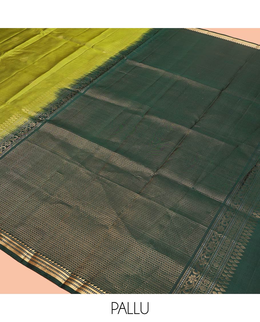 Green Mayuri Soft Silk Saree, Beautifully Bedecked with Zari Buttas All Over Its Body, Complemented by Contrast Border of Ara Bogudi, Muthu, Banaras, and Kathir Designs, Pallu of Neli, Muthu, and Banaras Designs, and Paired with Contrast Blouse