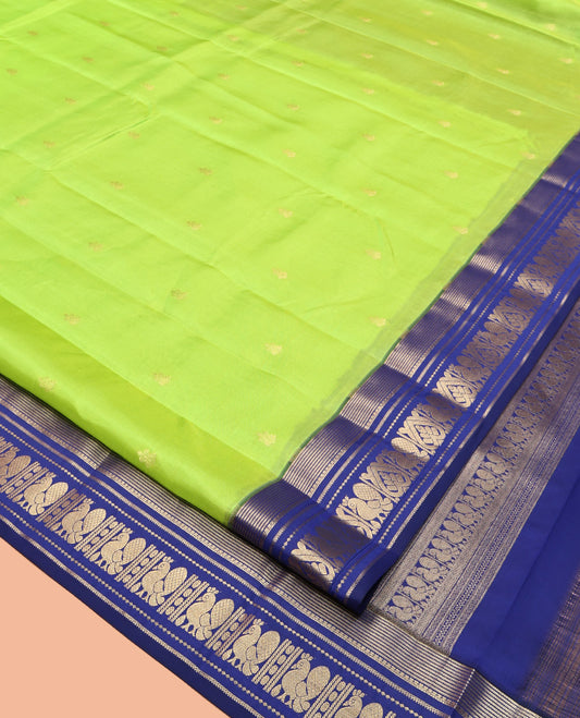 Green Vasundhara Lite Silk Mix Saree, Sparsely Sparkled with Zari Buttas, Complemented by a Contrast Zari Border of Mayil Design, Pallu of Mayil Designs, and a Contrast Blouse