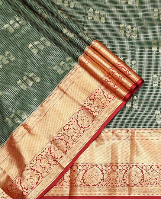 Green Art Silk Material Half Saree Set Featuring a Zari Buttas and Checked Skirt, a Contrast Traditional Zari Design Border, Contrast Blouse, and Zari Designs Dhavani