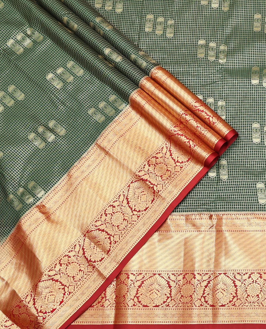 Green Art Silk Material Half Saree Set Featuring a Zari Buttas and Checked Skirt, a Contrast Traditional Zari Design Border, Contrast Blouse, and Zari Designs Dhavani