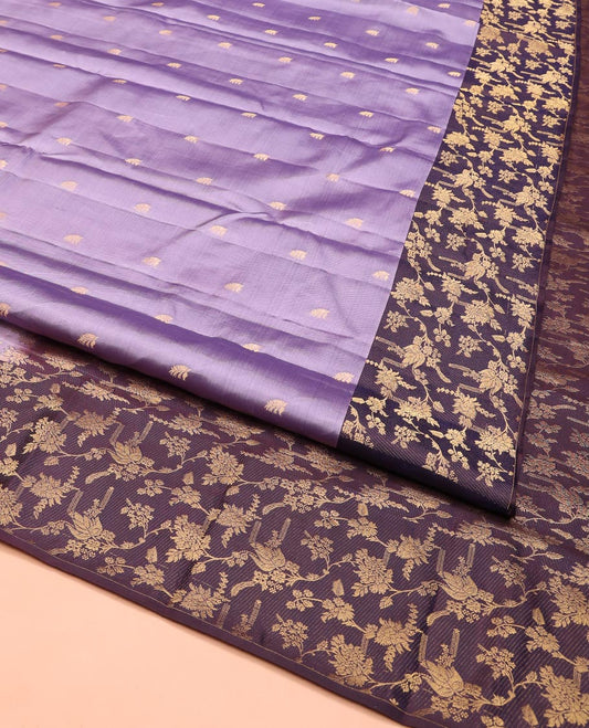 Lavender Vasundhara Silk Saree, Ornamented with Zari Buttas on Its Body, Complemented by Contrast Zari Border of Floral Jaal Designs, Gracefully Embellished Pallu of Floral Jaal Designs, and Paired with a Contrast Blouse