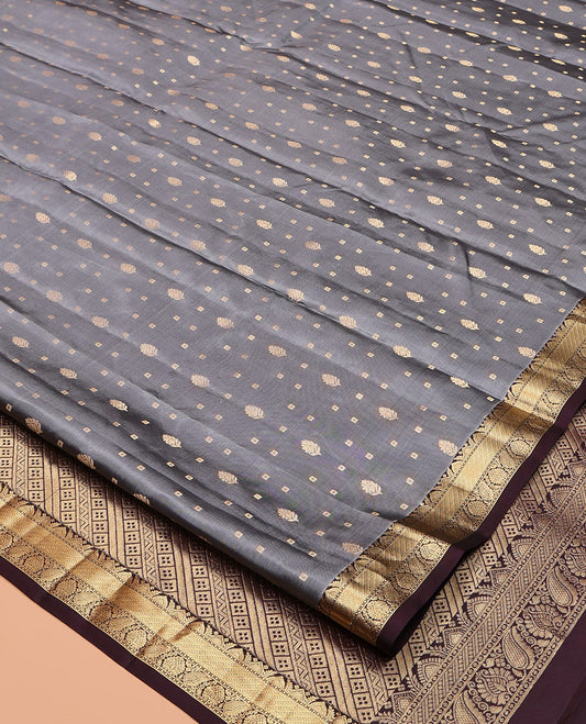 Grey Vasundhara Silk Saree, Subtly Sparkled with Zari Buttas, Contrast Traditional Zari Border, Geometric Pallu, and a Contrast Blouse