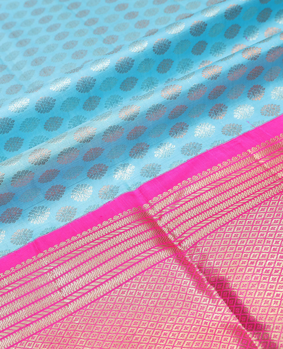 Blue buttas silk half saree with contrast border of intricate zari design, zari design blouse & floral design dhavani