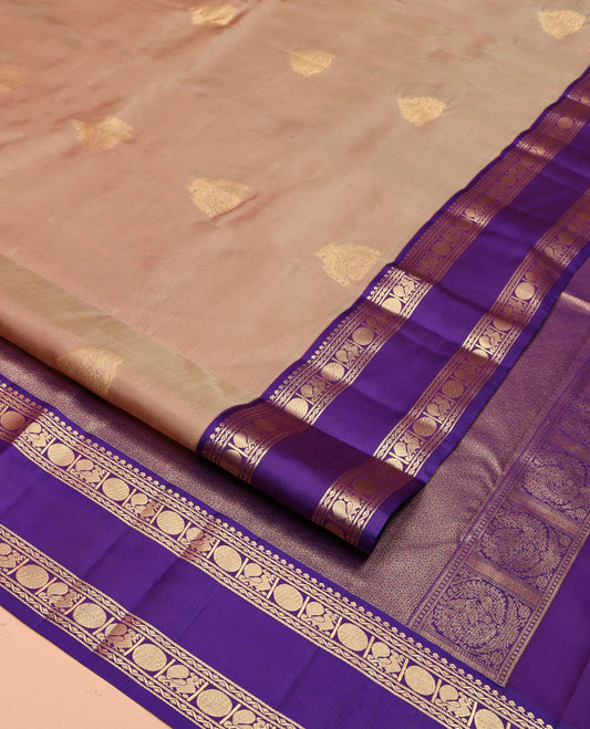 Beige Vasundhara Lite Silk Mix Saree, Accentuated With Zari Buttas All Over Its Body, Complemented by Contrast Rettai Pettu Border of Salngai, Neli, Poun and Mayil Designs, Gleaming Zari Pallu, and Paired with a Contrast Blouse