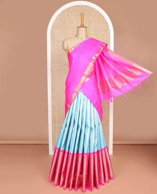 Blue buttas silk half saree with contrast border of intricate zari design, zari design blouse & floral design dhavani