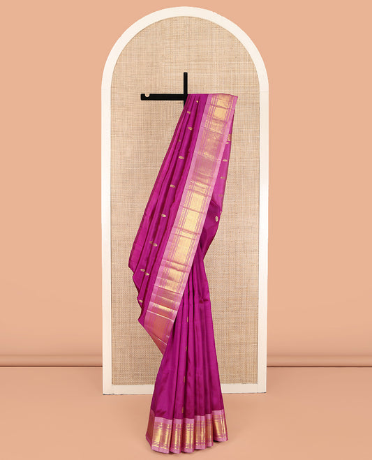 Pink Kanchipuram Silk Saree, Ornamented with Zari Buttas on Its Body, Complemented by a Contrast One-Sided Border of Panner Sombu, Banaras, Muthu, and Jaal Designs, Pallu of Zari Designs, and Comes Without a Blouse