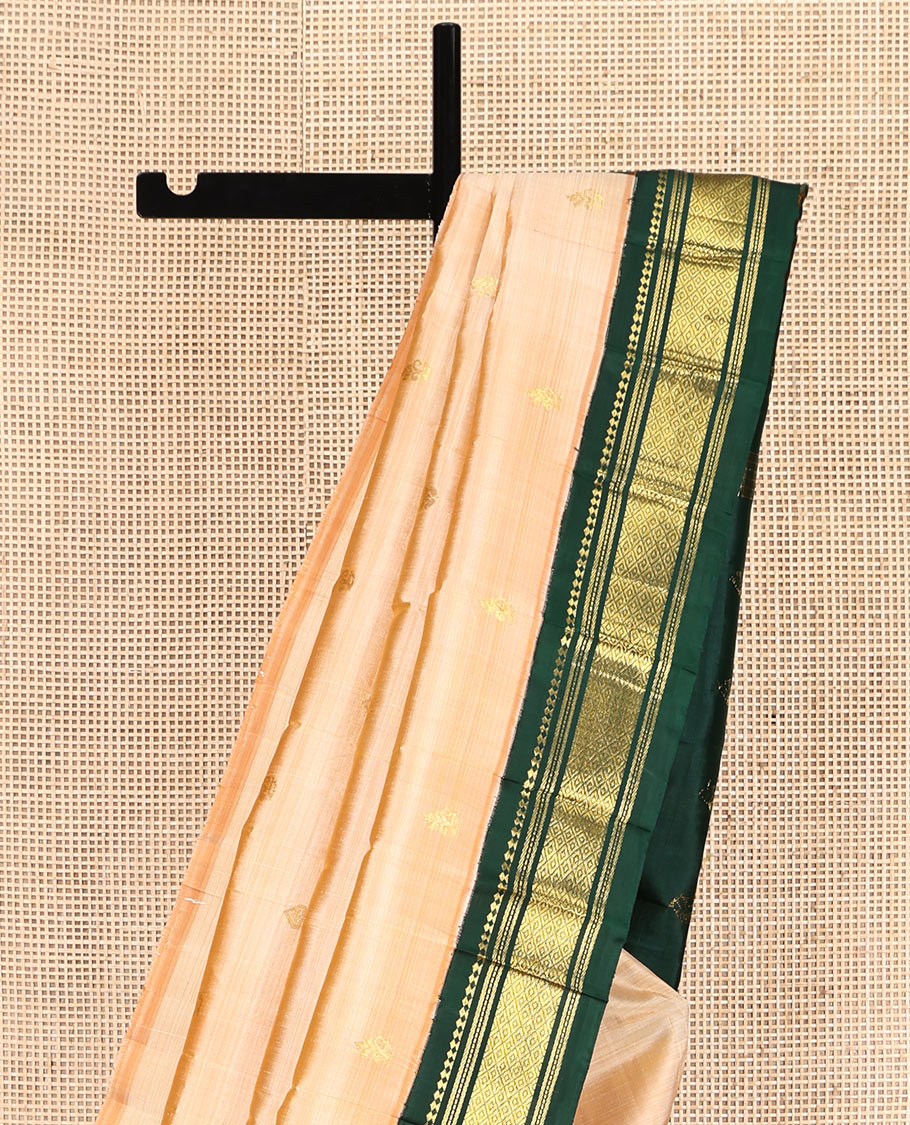 Sandal Kanchipuram Silk Saree, Sparsely Sparkled with Zari Buttas, Contrast One-Sided Korvai Border of Panner Sombu, Banaras, Muthu, and Mayil Kann Designs, Zari Design Pallu, and No Blouse