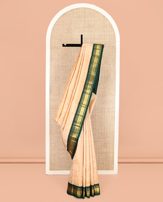Sandal Kanchipuram Silk Saree, Sparsely Sparkled with Zari Buttas, Contrast One-Sided Korvai Border of Panner Sombu, Banaras, Muthu, and Mayil Kann Designs, Zari Design Pallu, and No Blouse