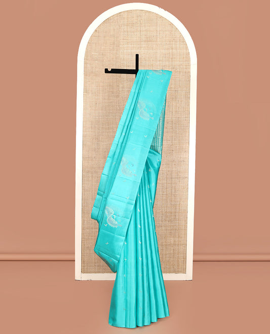 Borderless Blue Mayuri Soft Silk Saree, Subtly Woven with Buttas All Over Its Body, Highlighted by Pallu of Sparsely Woven Designs, and Paired with a Matching Blouse