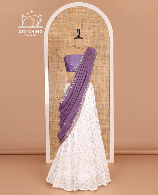 Cream-lavender half-saree, gold chevron striped nylon viscose crepe skirt, contrast diamond buttas blouse, and  a contrast scallop floral-theme embroidered dhavani