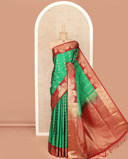 Green Semi-Soft Silk Saree Artfully Detailed with Square-Shaped Buttas Woven All Over Its Body, Complemented by a Contrast Elephant Motifs Zari Border, Pallu Highlighted with Chevron Designs, and Paired with a Contrast Blouse