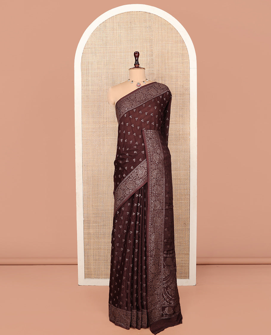 Brown Fancy Crepe Saree, Subtly Sparkled with Buttas, Highlighted by a Floral Creeper Border, Intricate Pallu, and a Matching Blouse