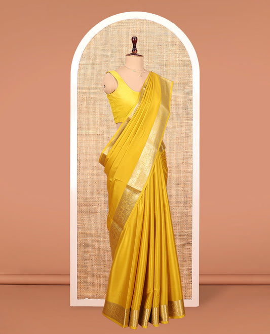 Yellow Plain Mysore Silk Saree, Highlighted by a Zari Border of Yaali Designs, Pallu Steeped with Zari Designs, and Paired with a Matching Blouse