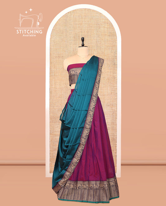 Purple Cotton Half-Saree Features Plain Skirt, a Contrast Traditional Thread Border, a Matching Blouse, and a Contrast Dhavani