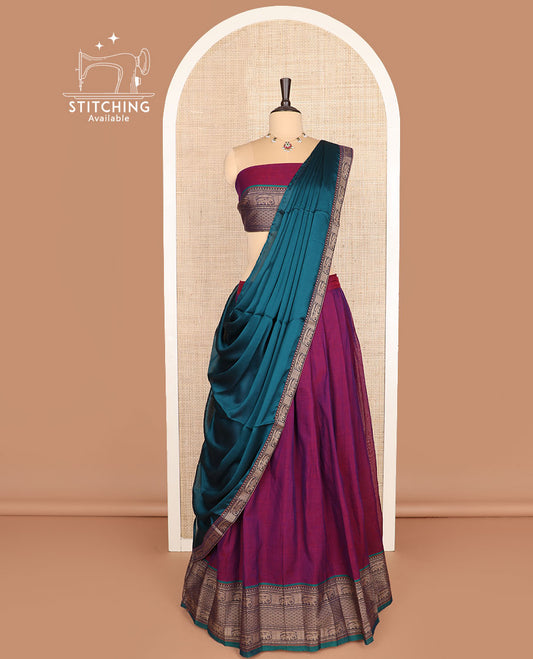 Purple cotton half-saree, plain with contrast traditional border skirt, a matching blouse, and a contrast traditional bordered dhavani