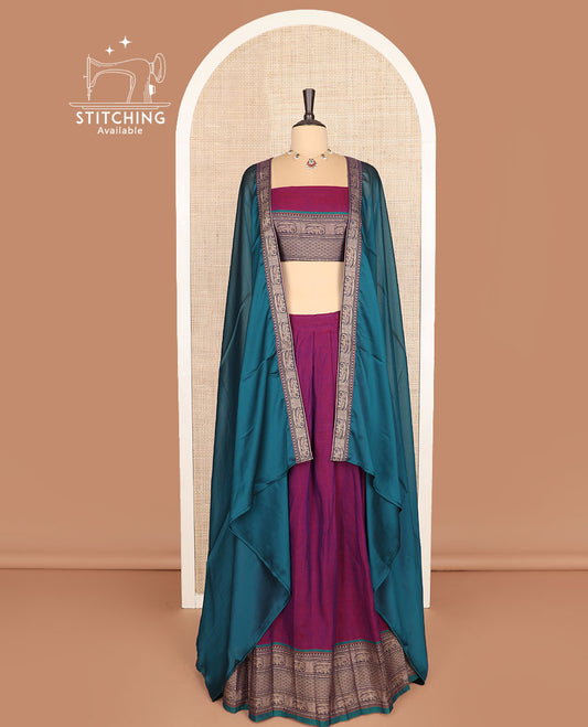 Purple cotton half-saree, plain with contrast traditional border skirt, a matching blouse, and a contrast traditional bordered dhavani