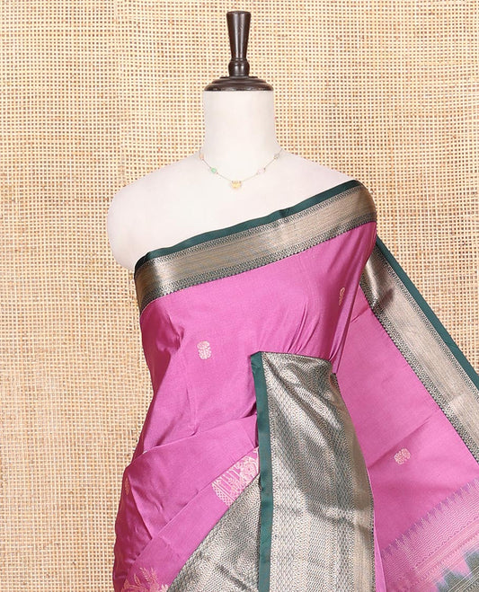 Pink Budget Silk Saree, Graced with Zari Buttas on Its Body, Complemented by a Contrast Traditional Zari Design Border, Pallu of Traditional Designs in Zari, and Paired with a Contrast Blouse