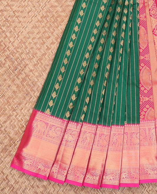 Green Budget Silk Saree, Gleamed Up with Zari Buttas and Stripes All Over Its Body, Complemented by a Contrast Traditional Zari Border of Peacock and Elephant Designs, Mughal-Style Intricately Designed Pallu, and Paired with a Contrast Blouse