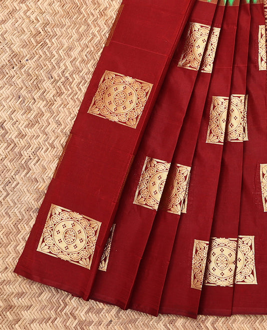 Borderless Red-Green Budget Silk Saree Features Embossed and Zari Buttas, Complemented by a Contrast Intricate Pallu, and a Contrast Blouse