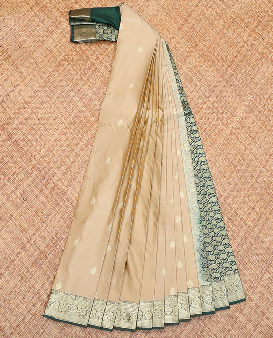 Champagne Color Budget Silk Saree, Graced with Zari Buttas All Over Its Body, Complemented by a Contrast Traditional Zari Design Border, Pallu of Paisley Butta Enclosed Jaal Designs, and Paired with a Contrast Blouse