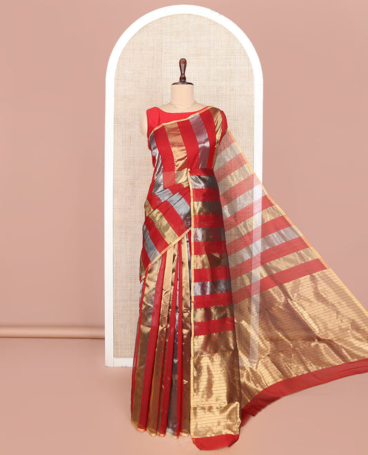 Borderless Red Chanderi Cotton Saree, Gleaming with Zari Stripes All Over Its Body, Highlighted by Pallu Steeped with Zari Stripes, and Paired with a Matching Blouse