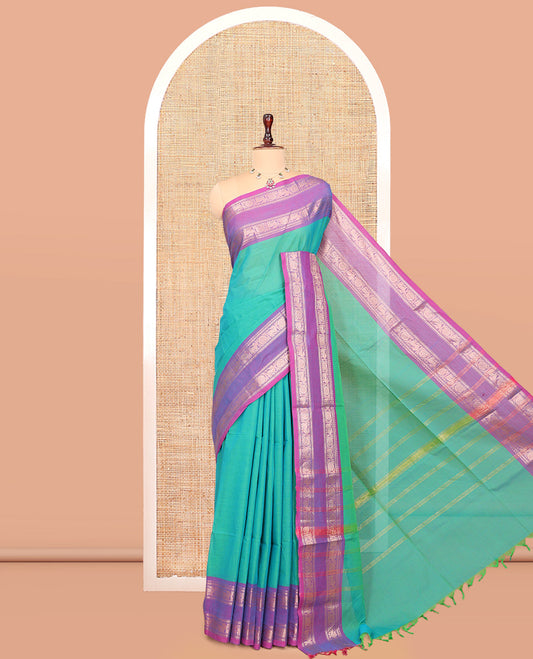 Aqua Green Chettinad Plain Cotton Saree, Defined by a Contrast Rettai Pettu Yaazhi-Chakra Border, a Striped Pallu and a Matching Blouse