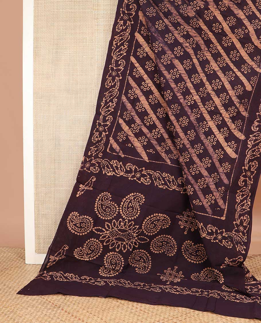 Brown floral batik printed sungudi cotton saree,  batik printed border, and pallu of paisleys and kolam motifs