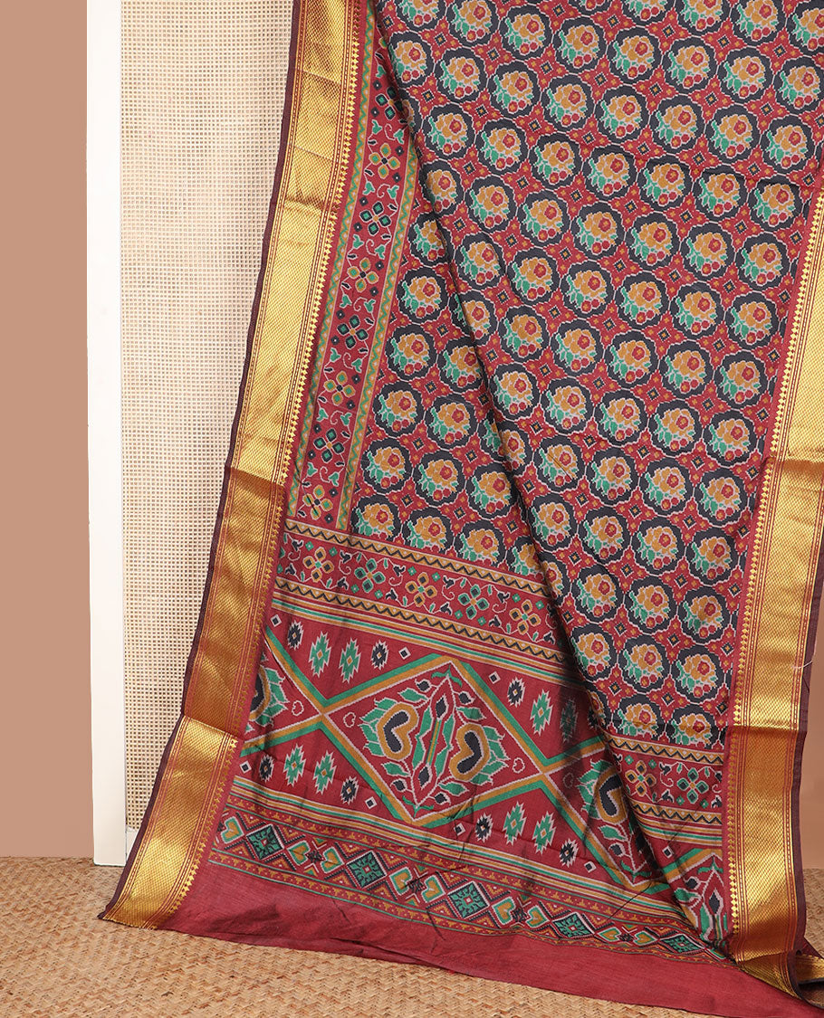 Black ikkat design semi-banaras patola silk saree, traditional zari design border, and ikkat design pallu