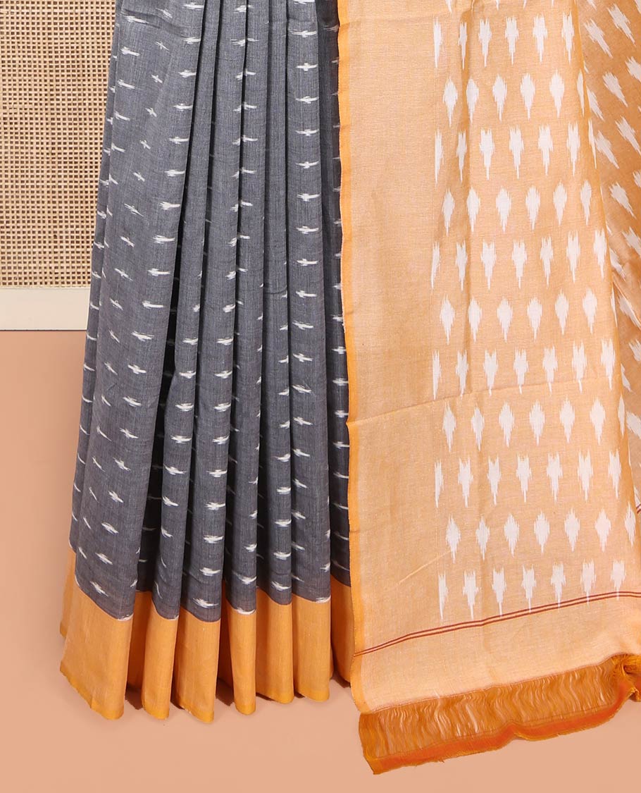 Grey Ikkat Cotton Saree, Decked Up with Ikkat-Style Buttas on Its Body, Complemented by Contrast Border, Pallu Steeped with Ikkat Buttas, and Has No Blouse