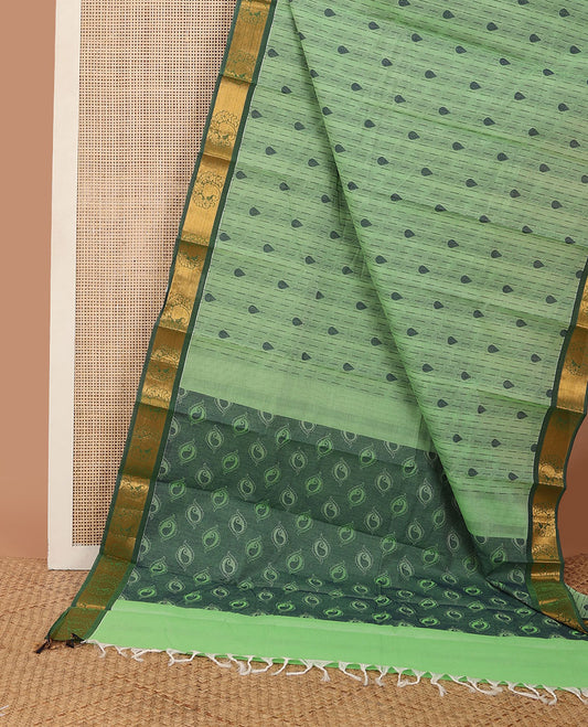 Green buttas kanchi cotton saree, contrast zari paisley border & pallu steeped with paisley motifs