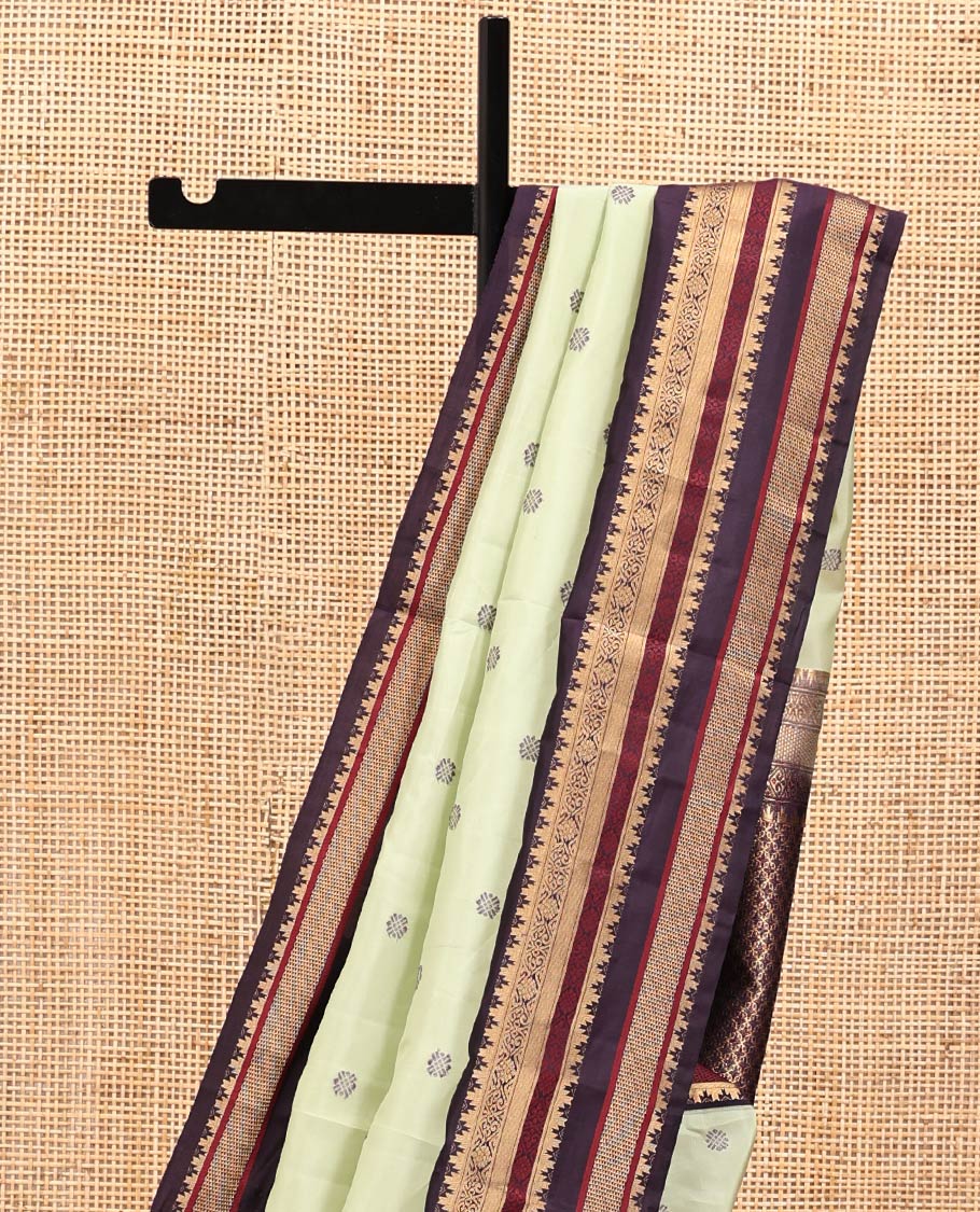Pista Green and Coffee Brown Vasundenhara Lite Silk Mix Saree, Subtly Adorned with Buttas All Over Its Body, Complemted by Contrast Border of Thazampoo Rekku, Banaras, Jada Nagam, and Ara Maadam Designs, Grand Pallu, and Paired with a Contrast Blouse