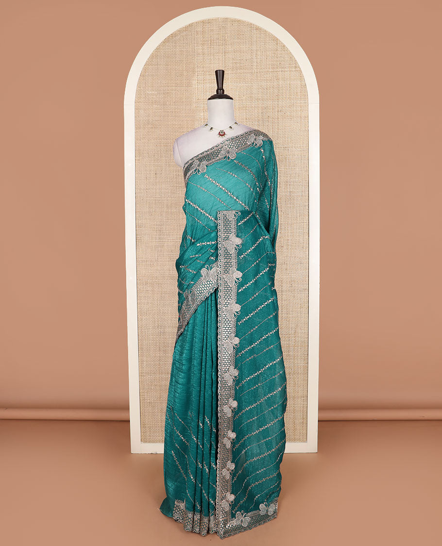 Green diagonal vine stone and thread embroidered designer saree, butterfly scallop embroidered border, and pallu