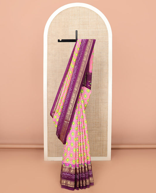 Candy Pink Ikkat Silk Saree Adorned with Ogee Patterns, Complemented by a Contrasting Elephant Zari Border, a Hazily Woven Pallu of Intricate Patterns, and a Contrasting Blouse