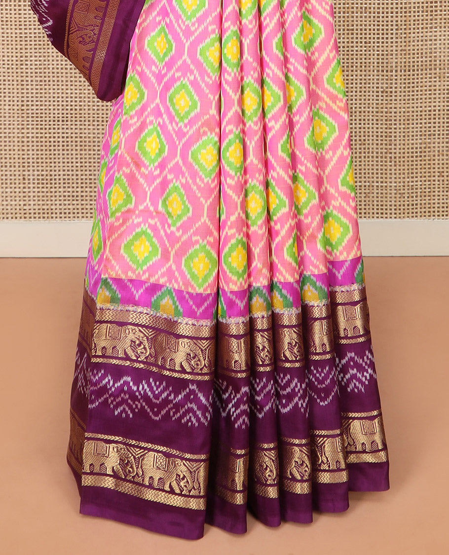 Candy Pink Ikkat Silk Saree Adorned with Ogee Patterns, Complemented by a Contrasting Elephant Zari Border, a Hazily Woven Pallu of Intricate Patterns, and a Contrasting Blouse