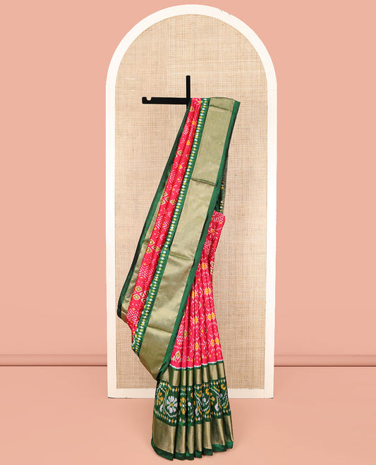 Red Ikkat Silk Saree, Ornamented with Ikkat Buttas Enclosed Checks All Over Its Body, Complemented by a Contrast Border of Floral Creeper Ikkat and Diamond Zari Designs, Pallu of Floral Creeper Designs, and Paired with a Matching Blouse