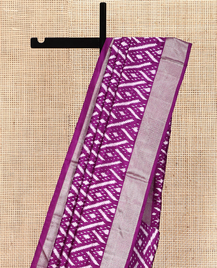 Purple Pochampally Ikat Silk Saree, Accentuated with Ikat Geometric Designs on Its Body, Highlighted by a Zari Chevron Border, Pallu of Ogee Pattern in Ikkat Weave, and Paired with a Matching Blouse