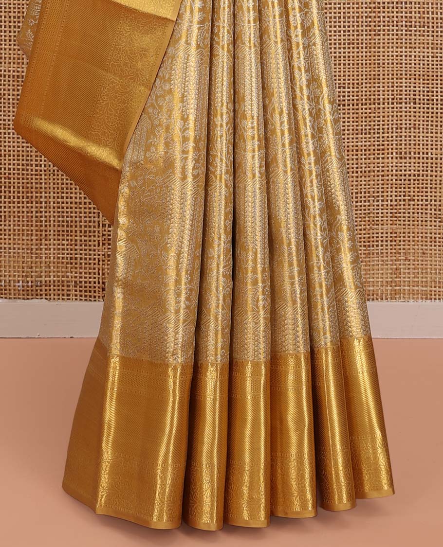 Gold Kanchipuram Tissue Silk Saree, Opulently Embellished with Jacquard Designs on Its Body, Highlighted by a Zari Border of Traditional Designs, Intricately Designed Pallu, and Paired with a Matching Blouse