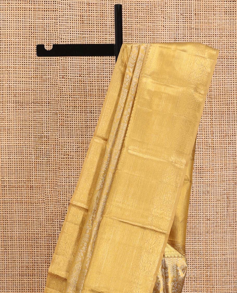 Gold Kanchipuram Tissue Silk Saree, Opulently Embellished with Jacquard Designs on Its Body, Highlighted by a Zari Border of Traditional Designs, Intricately Designed Pallu, and Paired with a Matching Blouse