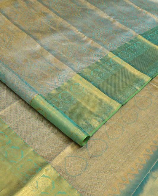 Blue jacquard Kanchipuram silk saree, contrast border of thilakam mokku, mayil, diamond, kodi visiry, and zari stripes, and zari-rich jaal pallu