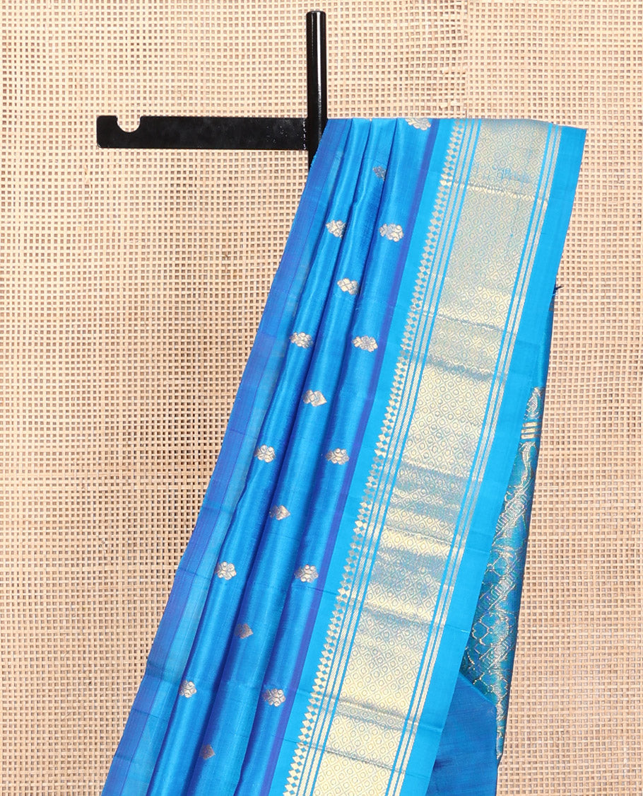 Blue Kanchipuram Silk Saree, Detailed with Zari Buttas, a One-Sided Border Featuring Panner Sombu, Banaras, and Jaal Design, Pallu of Kodi Visiry, and No Blouse