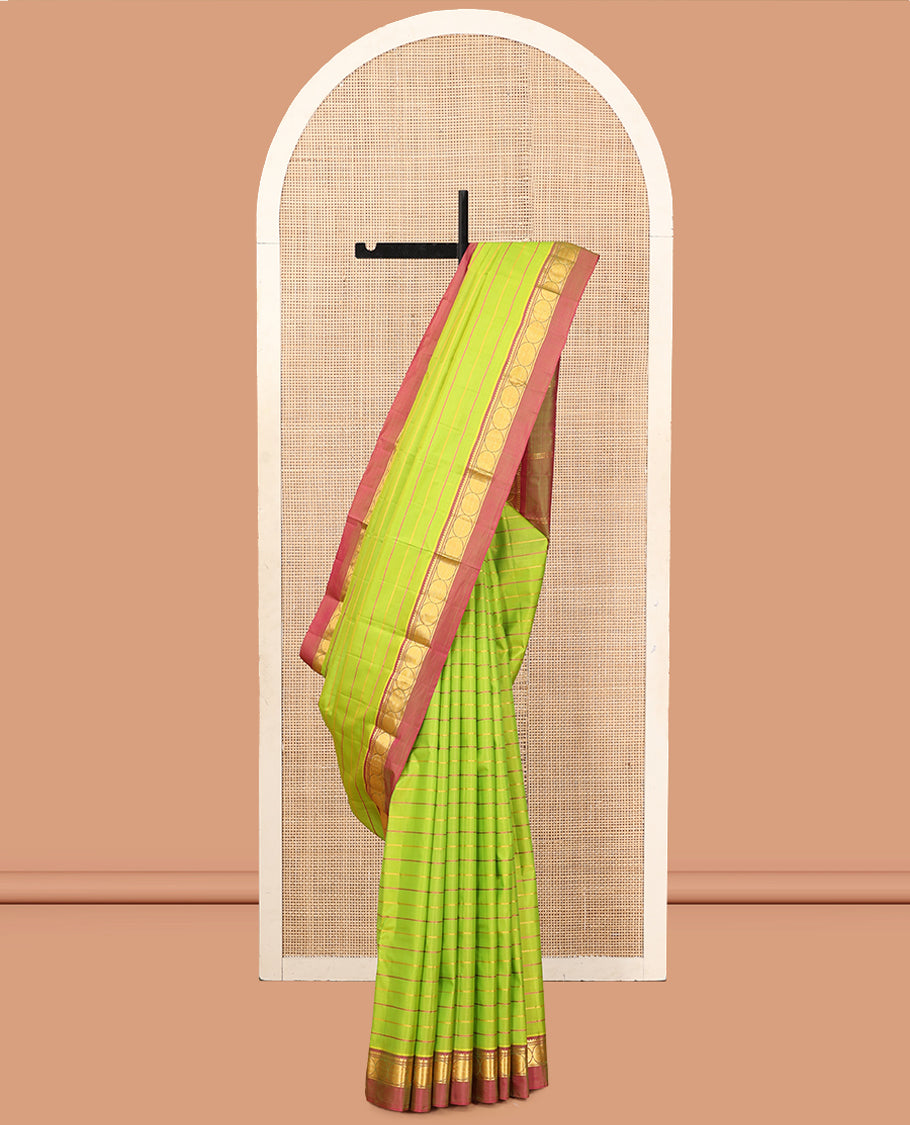 Green Veldhari Striped Kanchipuram Silk Saree, Complemented by a Contrast Kal Eragina Border of Thilakam Mokku, and Rudraskham Design, Pallu of Zari Stripes, and a Contrast Blouse