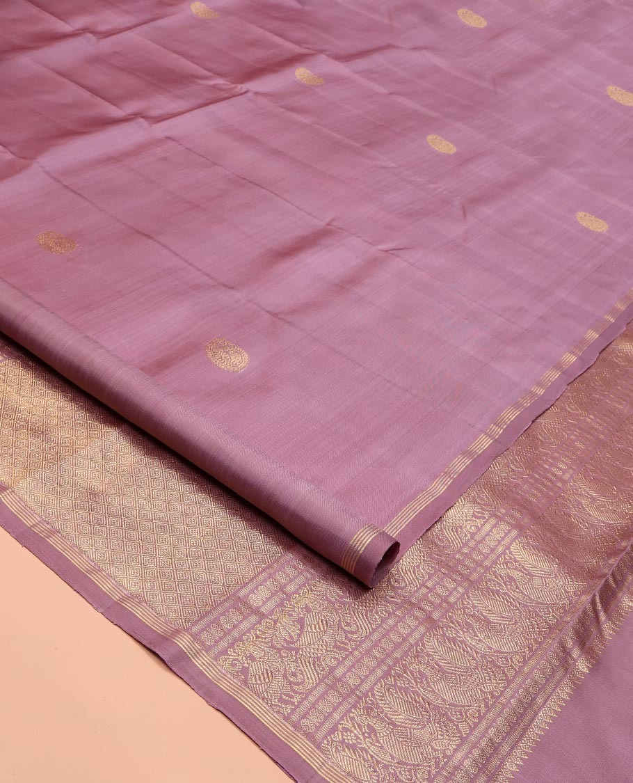 Pink Kanchipuram Silk Saree, Beautified with Arumbu Manga Zari Buttas All Over Its Body, Highlighted by a Zari Piping Border, Pallu of Jaal and Mayil Designs, and Paired with a Matching Blouse