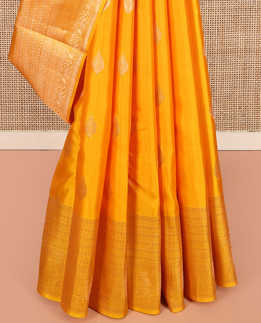 Yellow Kanchipuram Silk Saree, Subtly Sparkled with Zari Buttas All Over Its Body, Highlighted by a Zari Traditional Design Border, Grand Pallu, and Paired with a Matching Blouse