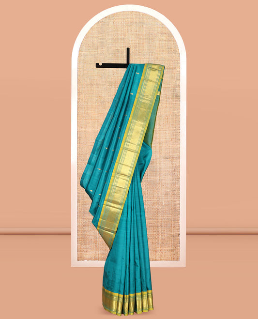 Green Kanchipuram Silk Saree, Adorned with Zari Buttas, Complemented by a Contrast One-Sided Border of Panner Sombu, Banaras, and Mayil Kann Designs, Zari Woven Pallu, and a No Blouse