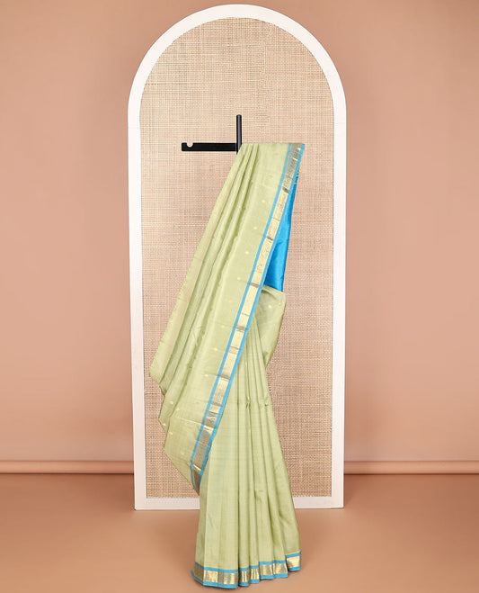 Green floral design kancheepuram silk saree with contrast floral design border & intricate zari desogn pallu