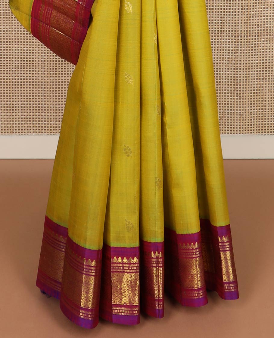 Green zari buttas silk saree, contrast one-sided border of thilakam mokku,banaras,muthu & then kuli kann & zari design pallu