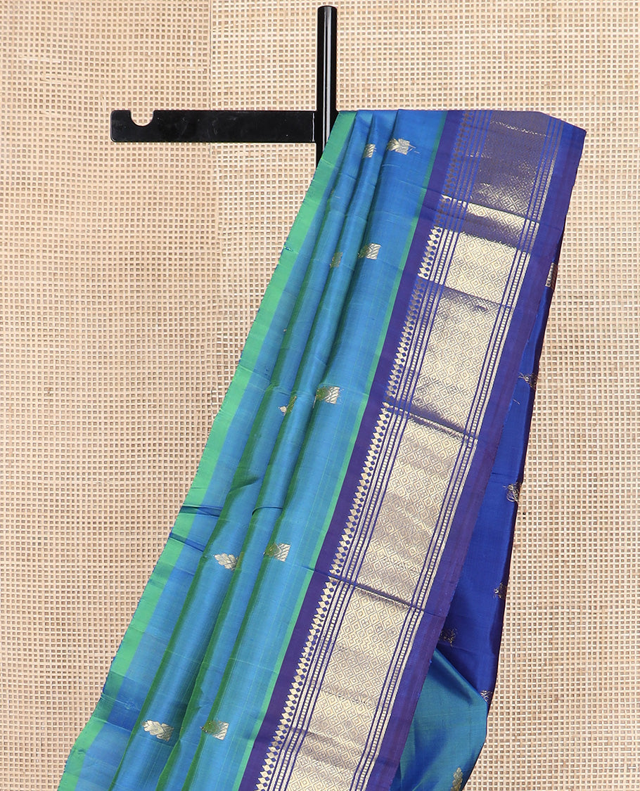Blue zari buttas Kanchipuram silk saree, contrast one-sided border of paneer sombu, banaras, muthu and jaal design, and zari design pallu