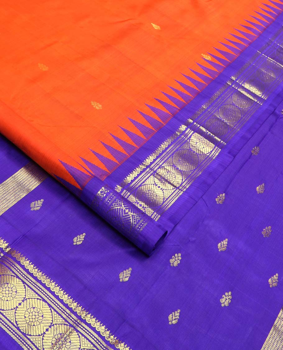 Orange zari buttas Kanchipuram silk saree, contrast one-sided thazampoo rekku border of salangai, banaras, muthu, and poo chakram designs, and zari design pallu