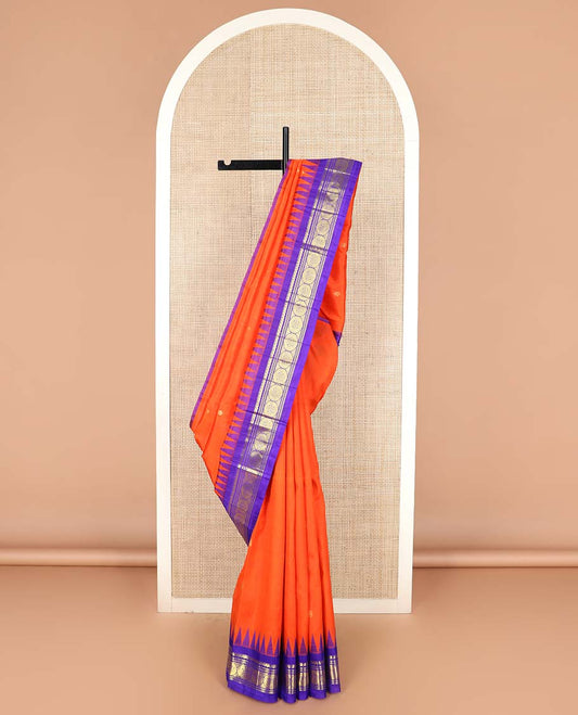 Orange zari buttas Kanchipuram silk saree, contrast one-sided thazampoo rekku border of salangai, banaras, muthu, and poo chakram designs, and zari design pallu
